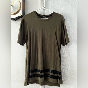 Green shirt with black stripes at the bottom